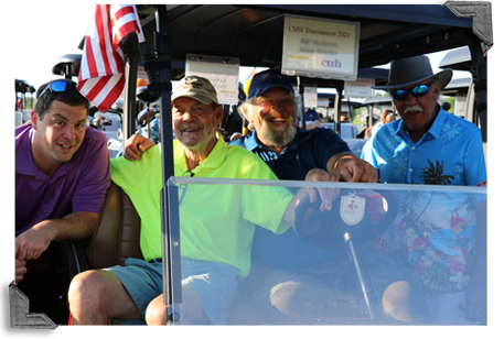Golf tournament participants by golf cart