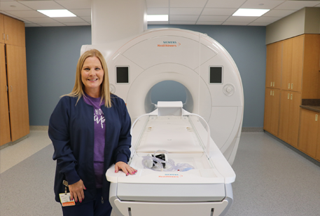 CMH staff, Angela Deckard, with MRI machine