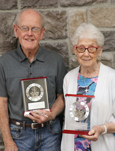 Lillian Hutcheon Award Winners - 2 elderly volunteers holding awards