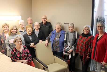 CMH volunteers with a donated recliner